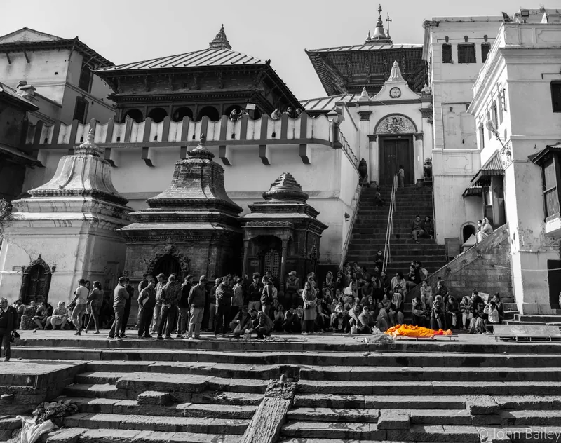 Black and white view of the stepped ghats and temple towers of Pashupatinath at dawn