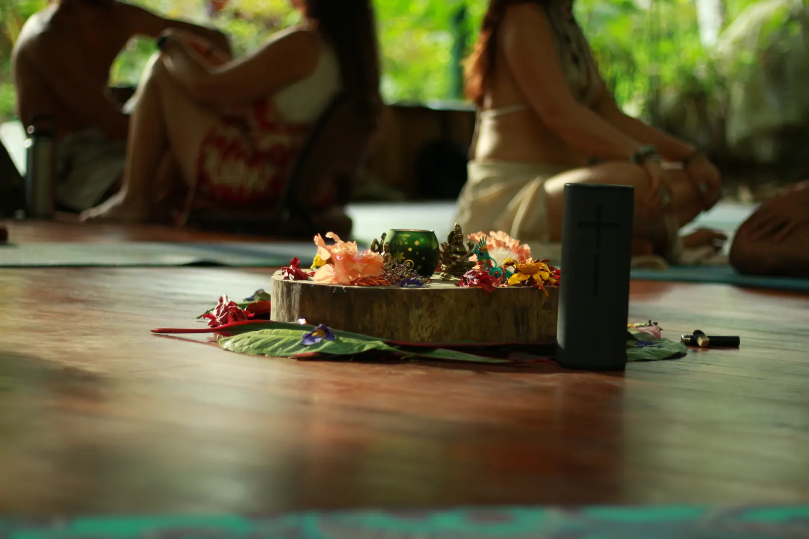 A flower altar at the centre of the shala floor